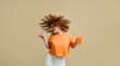 © Stock 4 You - Happy carefree young wavy-haired ginger woman dancing holding fresh juice drink cocktail in hand having fun celebrating start of relax vacation time isolated on turquoise copy space background