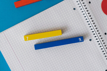 Wall Mural - Creative Сolorful math fractions on blue background. Interesting funny math for kids. Education, back to school concept. Geometry and mathematics materials. Flat lay, top view	