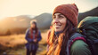 © wetzkaz - a young adult woman with a backpack on a mountain with a view of a valley and a mountain, nature and hiking, wanderlust, camping and hiking