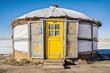 Traditional White Mongolian Ger with a Rustic Wooden Exterior and Striking Yellow Door - Perfect for Tourists and Travelers Exploring Local Architecture and Houses. Generative AI