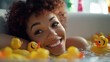 © wetzkaz - young adult woman takes a bath in the bathtub with a rubber duck, cute yellow bath duck, in the water, joyful and satisfied and happy and relaxed at home taking a bath