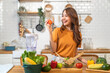 © Art_Photo - Portrait of beauty body slim healthy asian woman big smile cooking and preparing vegan food healthy holding apple, green apple, dental, teeth, fruit in kitchen at home.Diet.Fitness, healthy food