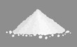 A pile of white powder matter on a gray background.