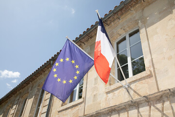 french and europa stars european flag of EU floats in city hall france facade