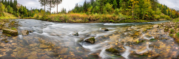 Canvas Print - wild river with big current in deep gorge