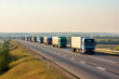 © alisaaa - convoy of trucks in line on a country highway