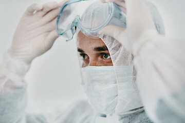 Poster - Man with face mask, goggles and safety from Covid, health policy and protection suit with disinfection. Crisis, healthcare compliance and male medical professional in PPE to protect against corona