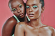Makeup art, women together and portrait in studio, beauty or cosmetic for diverse friends by background. Creative black woman, model girl and neon color for support, skin glow or futuristic aesthetic