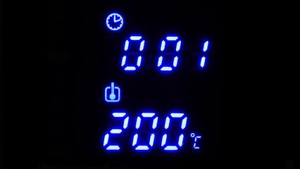 Aufkleber - blue LED oven timer. Two hundred degrees hot.