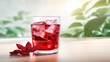 © HelgaQ - Hot tea with hibiscus in a glass cup, flower petals and splashes, the concept of longevity