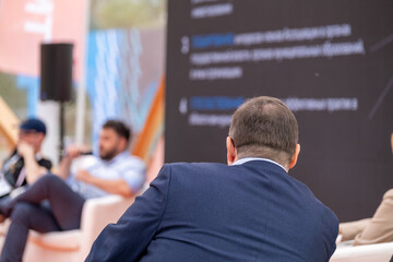 Poster - Unrecognizable businessman listening to talks from presenters