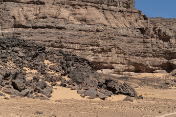 Wall Mural - view in the Sahara desert of Tadrart rouge tassili najer in Djanet City  ,Algeria.colorful orange sand, rocky mountains