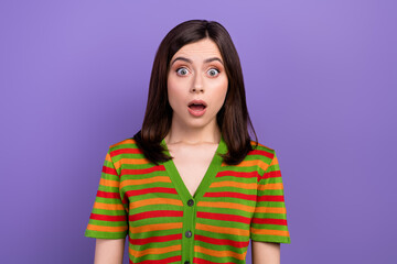 Wall Mural - Photo of impressed astonished woman with straight hairstyle wear colorful t-shirt staring wide open eyes isolated on purple background