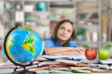 Wall Mural - School kid in the library at the school, education concept.