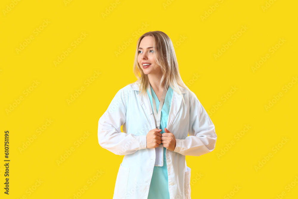 Female doctor on yellow background