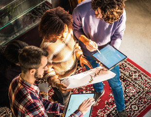 Top view of business finance coworkers working together in a modern office - Startup multicultural coworkers collaboration and cooperation concept