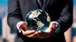 © Moritz - A businessman holds a global business globe, interconnected with a network, while focusing on digital marketing strategies and innovative solutions. Utilizing business development technology, this ind