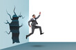 © Elnur - Businessman breaking through the wall