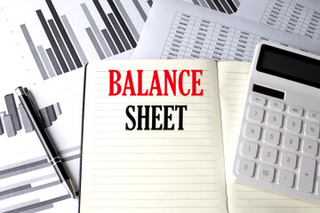 Poster - BALANCE SHEET text written on a notebook on chart and diagram
