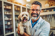 © VisualProduction - Smiley beautiful veterinarian examining a dog and posing with it, friendly patient, fur friend, animal clinic. Generative AI