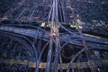 Night aerial view of the 110 and 105 freeway interchange south of downtown Los Angeles in Southern California.   