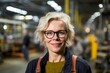 © Robert MEYNER - Portrait of a smiling female worker in a train station. Focus on the woman