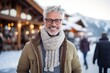 © Eber Braun - Medium shot portrait photography of a grinning man in his 50s that is wearing a chic cardigan against an active ski resort with visitors enjoying the slopes background .  Generative AI