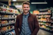 © Leon Waltz - Portrait of handsome young man smiling at camera while standing in supermarket