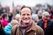 Medium shot portrait photography of a pleased man in his 50s that is wearing a chic cardigan against a lively political rally with passionate supporters background .  Generative AI