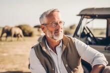 Medium Shot Portrait Photography Of A Satisfied Man In His 50s That Is Wearing A Chic Cardigan Against A Safari Adventure With Wildlife Encounters Background .  Generative AI