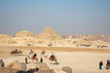 A picture of two pyramids, one complete and the other incomplete, in Egypt, in the area of the ancient Pharaonic pyramids in Giza