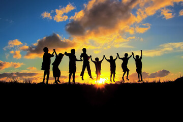 Wall Mural - silhouette of children friendships in sunset