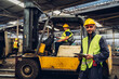 © kanpisut - Workers Factory or Engineering work at factory site check up machine or products in site. Foreman or Technician checking Material or Machine on Plant. Heavy industry factory concept.