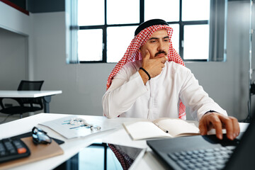 Poster - Young successful arab businessman working in the office