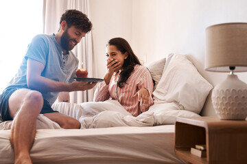 Poster - Couple, bedroom and surprise birthday candle, cupcake or celebration dessert for excited woman shocked over food gift. Muffin, wow and people smile, happiness and celebrate special day on home bed