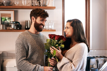 Poster - Flowers, surprise gift and happy couple with roses, floral present or flower bouquet for Valentines Day in home kitchen. Wow, bonding and romantic man with love present, care and enjoy quality time