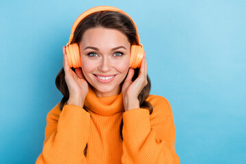 Sticker - Photo of funky sweet woman dressed orange sweater enjoying songs modern device empty space isolated blue color background