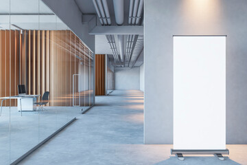 Poster - Front view on blank white rollup poster with space for logo or text on grey partition background on concrete floor in spacious office with wooden walls and glass doors. 3D rendering, mockup