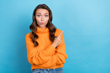 Poster - Photo of stunned shocked lady direct finger empty space not believe eyes wear knitted sweater isolated blue color background