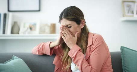 Wall Mural - Sad woman, anxiety and crying on living room sofa in depression, divorce or stress at home. Upset or lonely female person sitting on couch suffering from mental health, burnout or emotional sadness