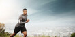 © Angelo J/peopleimages.com - Man, running and space for fitness with cityscape for exercise, wellness or music with mockup for health. African male runner listening to audio for focus, workout and nature outdoor with mock up sky
