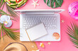 © ricka_kinamoto - Summer office, working background, blogger workplace flat lay. White laptop keyboard with notebook, straw hat, tropical decor and leaves, cold cocktail glass on high-colored sunny pink background