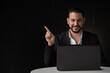 © Ranta Images - Portrait of handsome businessman using laptop computer