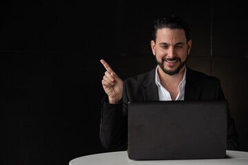 Wall Mural - Portrait of handsome businessman using laptop computer