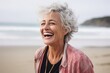 © Markus Schröder - Medium shot portrait photography of a grinning mature woman laughing against a serene beach background. With generative AI technology