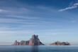 The island of es vedra in sunny day, beautiful reflection of blue sky, Ibiza, Spain