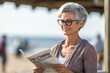 Environmental portrait photography of a satisfied mature woman reading the newspaper against a picturesque beach boardwalk background. With generative AI technology