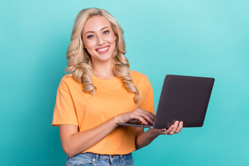 Poster - Photo of positive cute lady dressed orange t-shirt chatting instagram twitter telegram facebook isolated teal color background