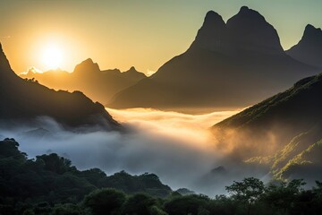 Canvas Print - magnificent mountain range shrouded in mist, with the sun setting behind, created with generative ai