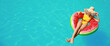 © Pixel-Shot - Beautiful young woman relaxing on inflatable ring in swimming pool. Banner for design